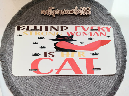 Behind every strong woman is her cat license plate